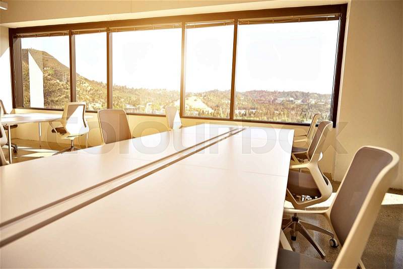 Conference room. Modern office with windows and city view, stock photo