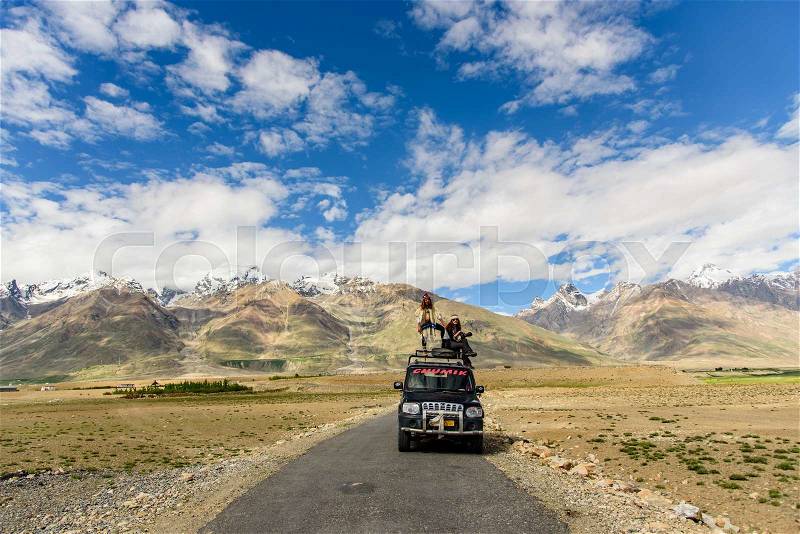 AMMU & KASHMIR, INDIA - 15 JULY 2015: Untitled tourist on adventure van along the road in sunny day, Jammu & Kashmir, India, stock photo