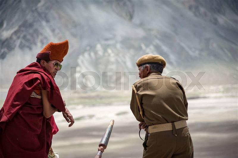 ZANSKAR, INDIA - JULY 15, 2015 : Untitled lama waiting for mystical mask dancing at Karsha Monastery (one of the oldest monastery), Zanskar, North India, stock photo