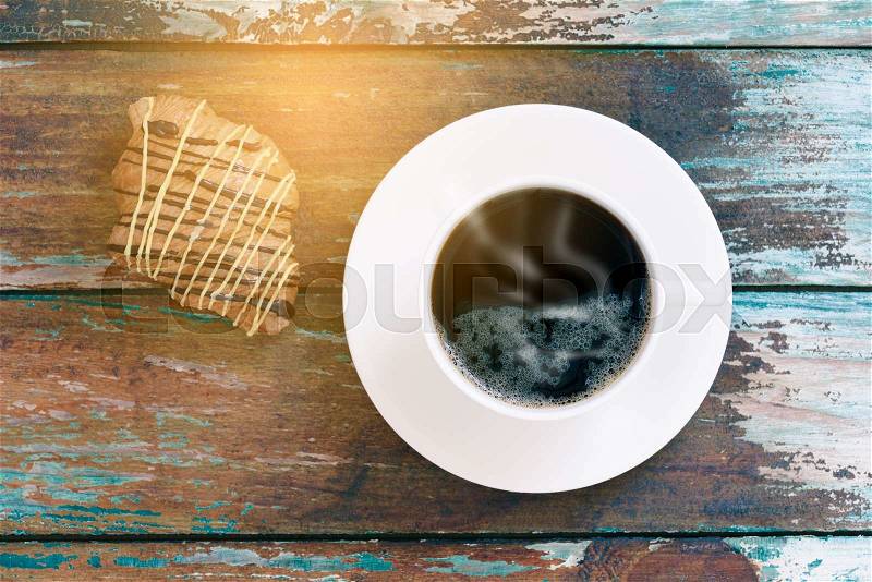 Top view of hot coffee and bread on wooden texture. , stock photo
