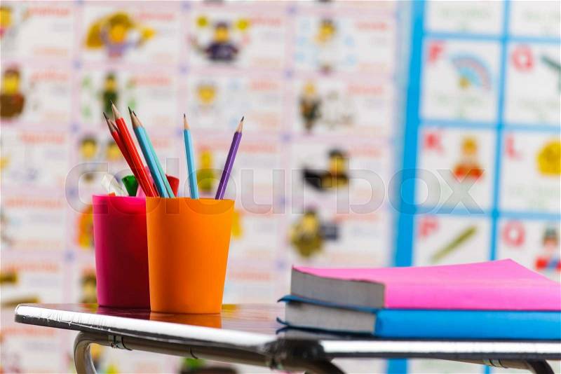 Pencils and book on table , stock photo
