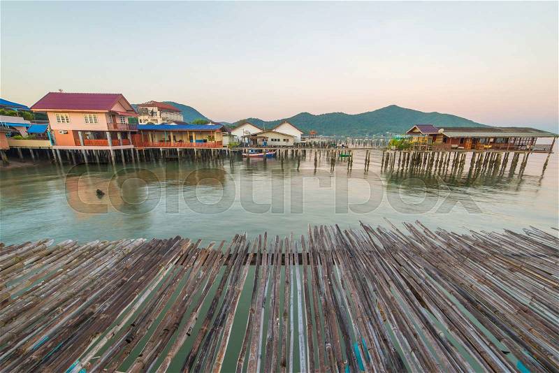 Bamboo floor with Fishing Village to the sea, stock photo