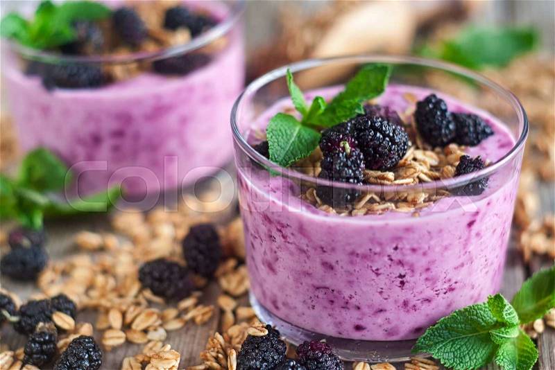 Mulberry smothie with homemade granola copy space background, stock photo