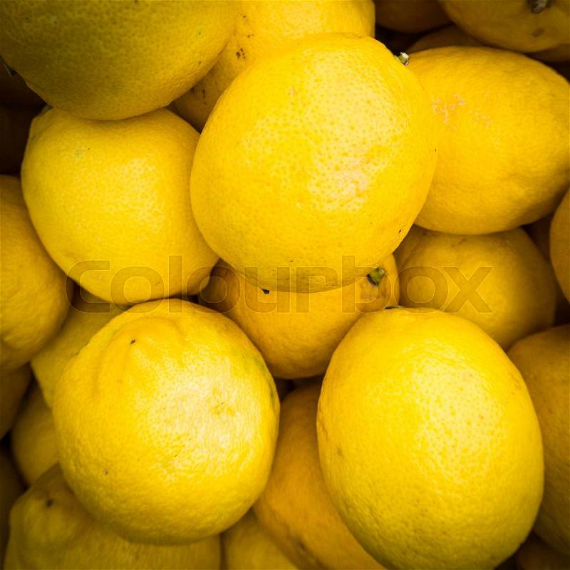 Lemons background. Group of fresh lemons, stock photo