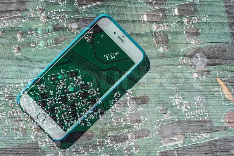 Smartphone and computer board blended, stock photo