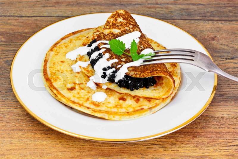 Pancakes with Black Caviar Studio Photo, stock photo