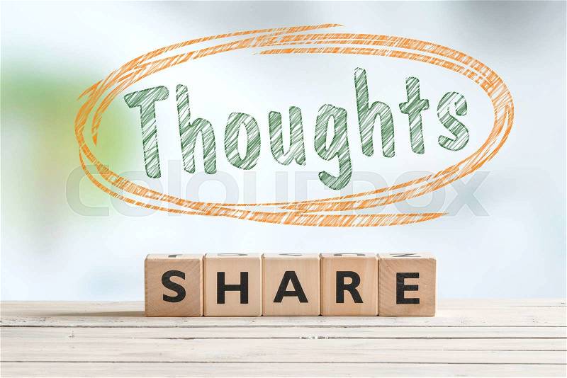 Share your thoughts sign on a desk made of wood, stock photo