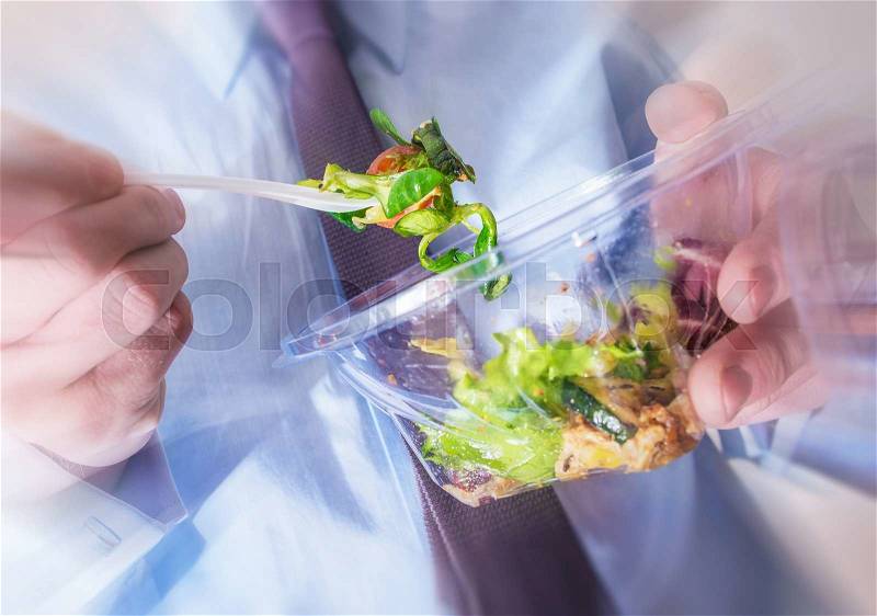 Healthy Office Food Eating Concept Photo. Office Worker Eating Diet Food. Salad From Plastic Container, stock photo