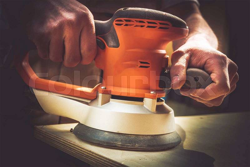 Restoring Wood Sections of Furniture by Sanding. Sanding Process Closeup, stock photo