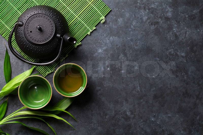 Green japanese tea on stone table. Top view with copy space, stock photo