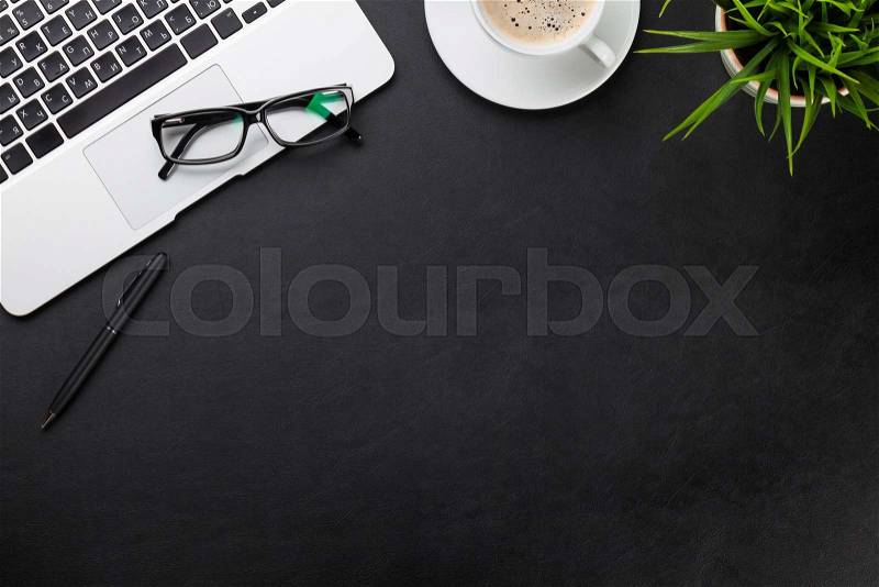 Office leather desk workplace table with laptop, coffee cup and plant. Top view with copy space, stock photo