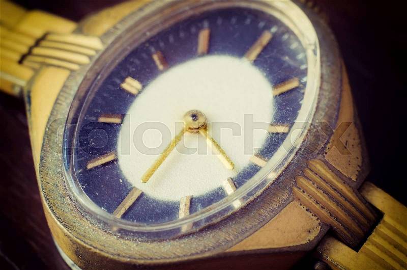 Old golden wrist watch macro, stock photo