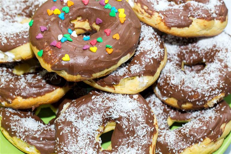Dessert baking donuts with chocolate and coconut, stock photo