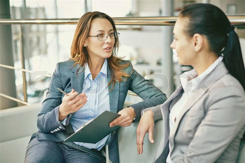 Hr manager asking questions to female candidate, stock photo