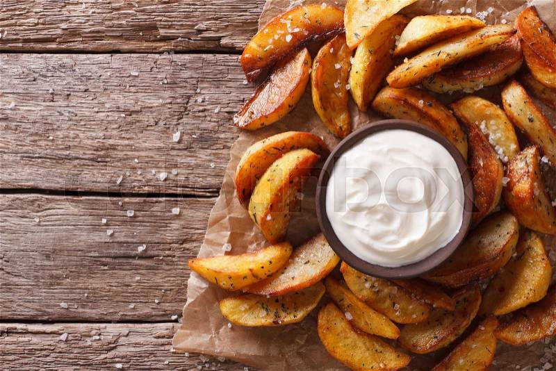 Fast food: Potato wedges and mayonnaise on the table. horizontal top view , stock photo