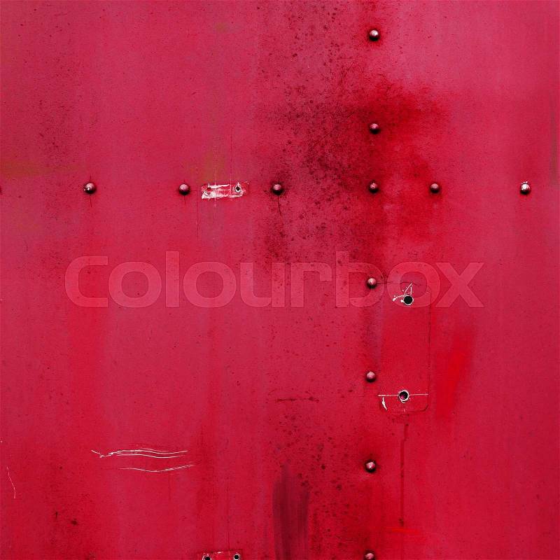 Riveted red metal. Abstract painted matte red metal background texture with rivets. Red metal background , stock photo