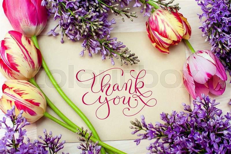 Beautiful frame of lilacs and tulips for greeting card with words thank you, stock photo
