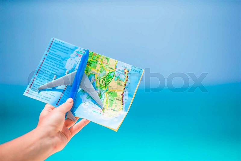 Closeup of map and model airplane background the sea, stock photo