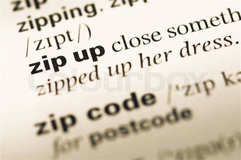 Close up of old English dictionary page with word zip up, stock photo