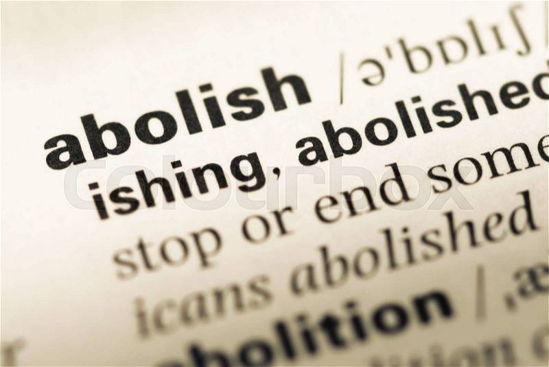 Close up of old English dictionary page with word abolish, stock photo