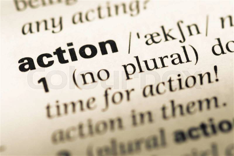 Close up of old English dictionary page with word action, stock photo