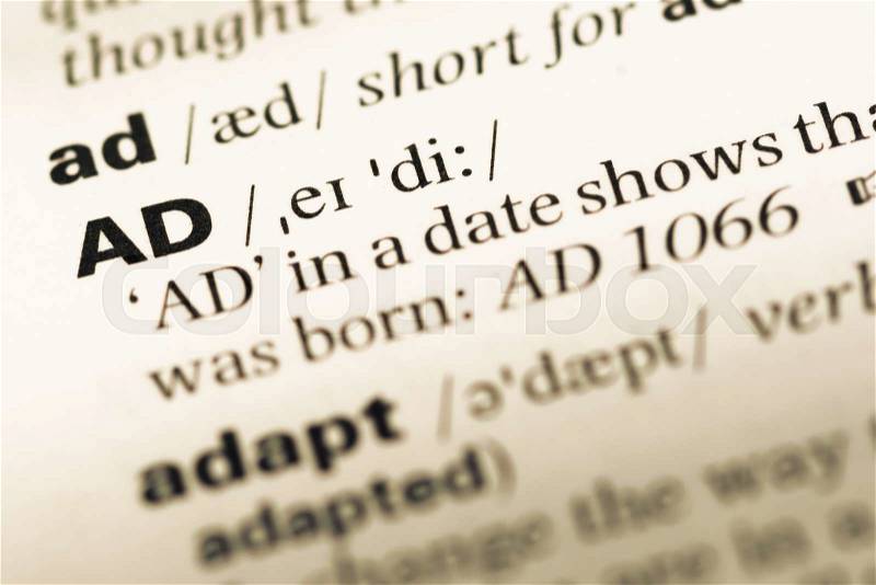 Close up of old English dictionary page with word AD, stock photo