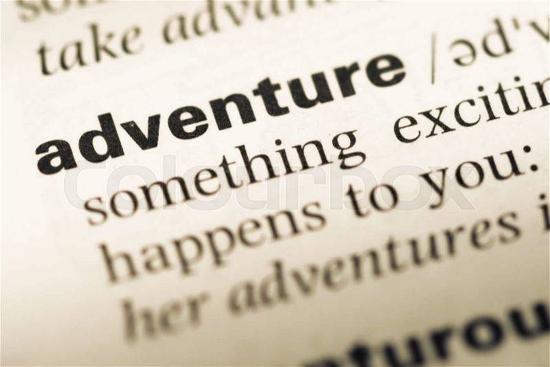 Close up of old English dictionary page with word adventure, stock photo