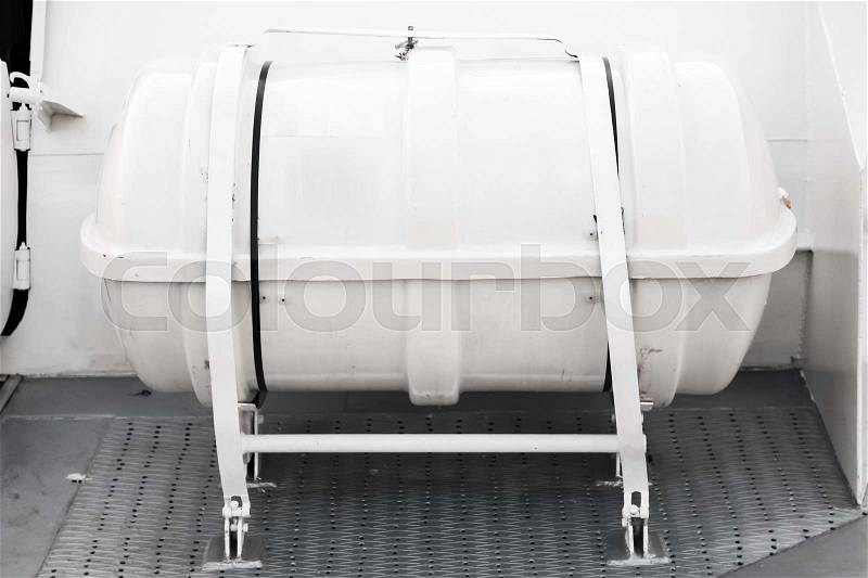 Inflatable liferaft in hard-shelled white canister. Modern passenger ship safety equipment, stock photo