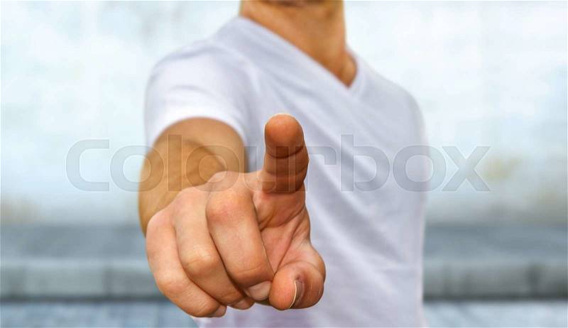 Business man in white tshirt pointing his finger, stock photo