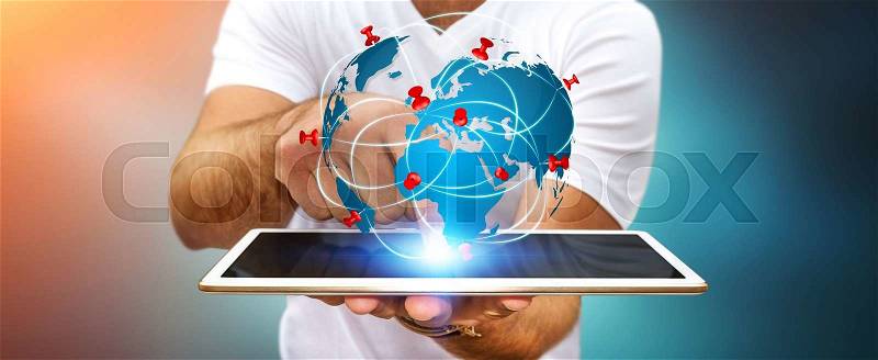 Businessman with digital world map and pins floating over his tablet, stock photo