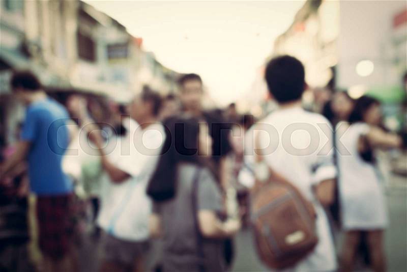 Abstract of blurred people on the street in vintage style background, stock photo