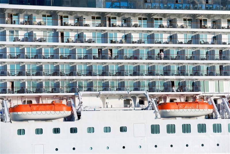 Board of luxury cruise ship with many decks, stock photo