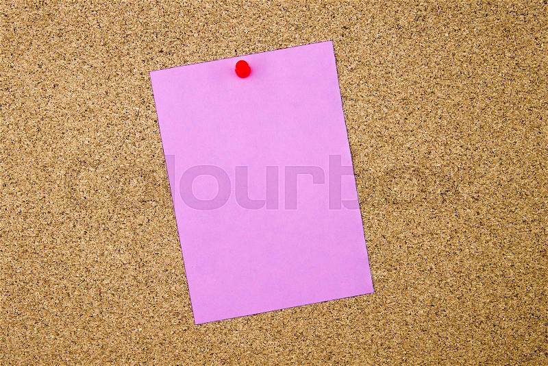 Blank violet paper note pinned on cork board with red thumbtack, copy space available, stock photo