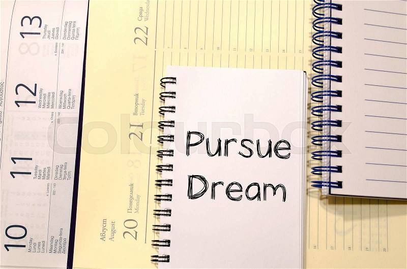 Pursue dream text concept write on notebook, stock photo