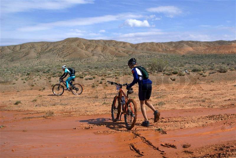 Bike race in desert mountains, stock photo