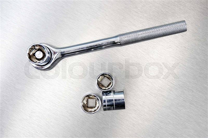 A studio photo of a socket wrench, stock photo