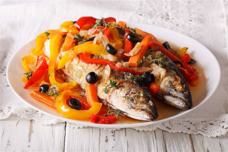 Latin American Food: escabeche of mackerel fish with vegetables close-up on a plate on the table. horizontal , stock photo