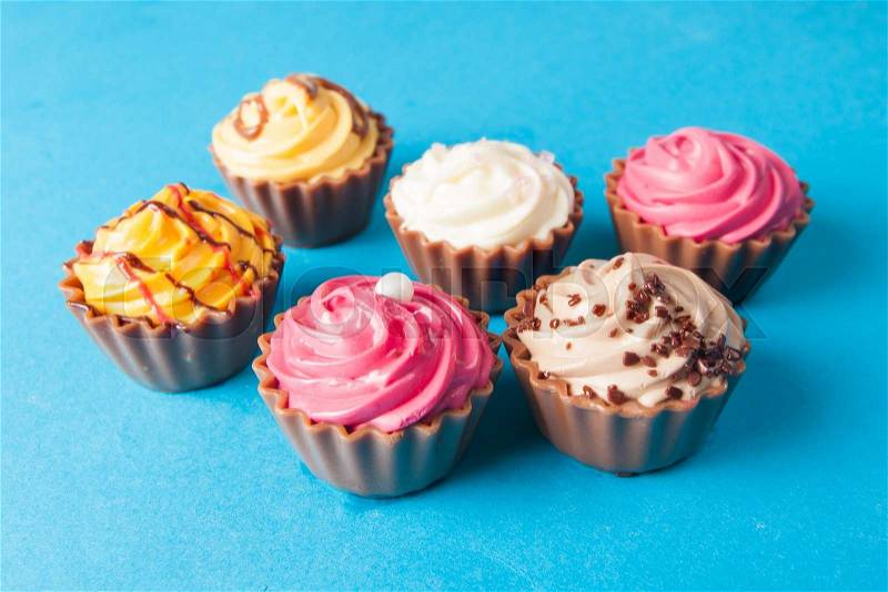 Birthday cupcakes on blue background. many sweet cupcakes, stock photo