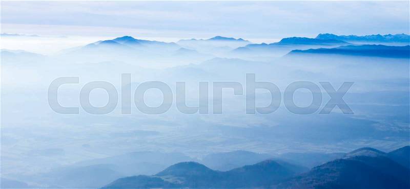 Blue foggy mountain landscape can be used as background, stock photo
