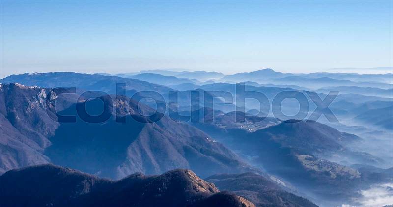 Blue foggy mountain landscape can be used as background, stock photo