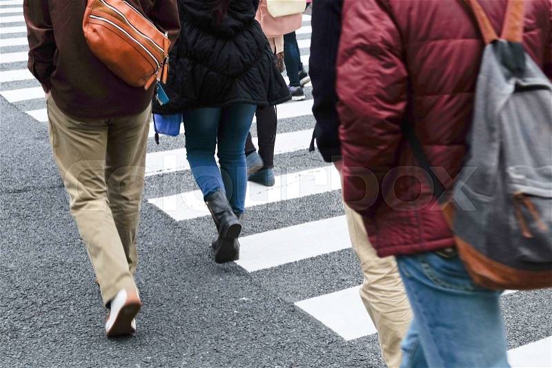 Crowd of people crossing at Ueno Hirokoji intersection, Tokyo Japan, stock photo