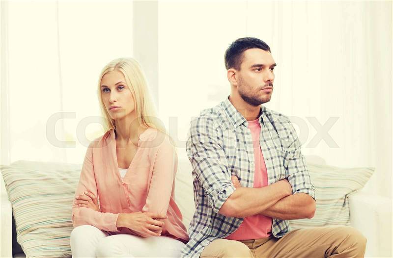 People, relationship difficulties, conflict and family concept - unhappy couple having argument at home, stock photo