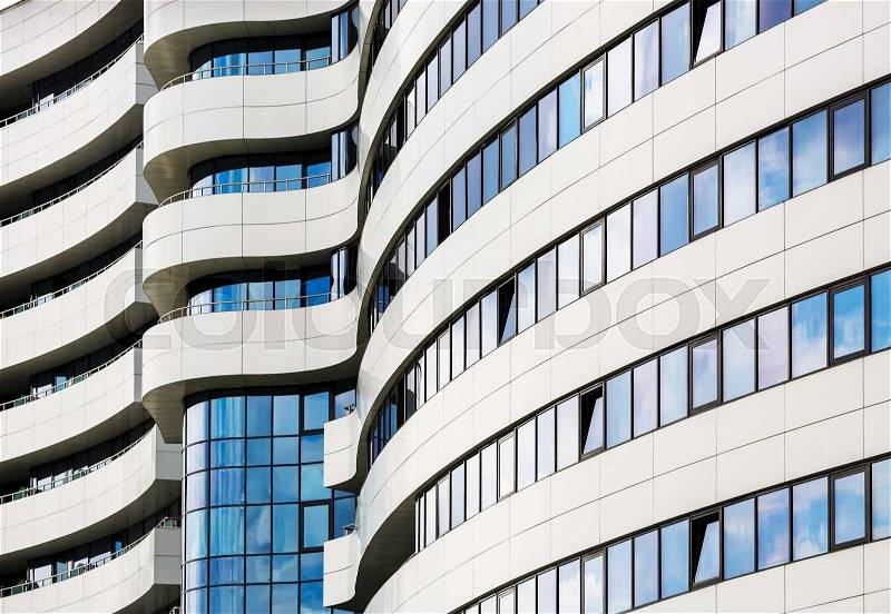 Abstract modern architecture. Modern building of steel and glass. Harmonious combination of smooth lines of modern architecture, stock photo