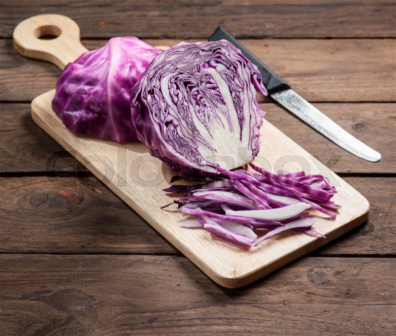 Chopped Red Cabbage on Wooden Cutting Board, stock photo