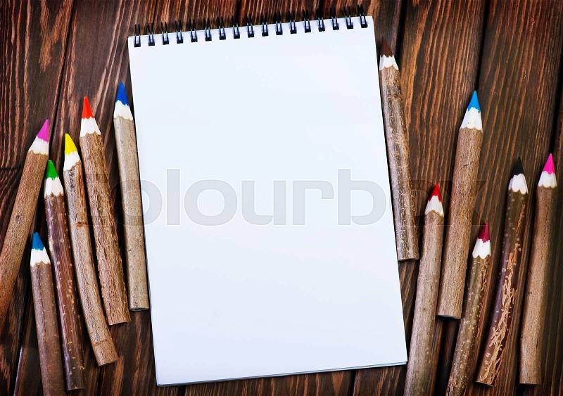 Color pencils on the wooden table, pencils on a table, stock photo