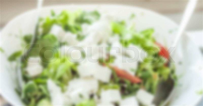 Blurred fresh spring salad can be used as background, stock photo