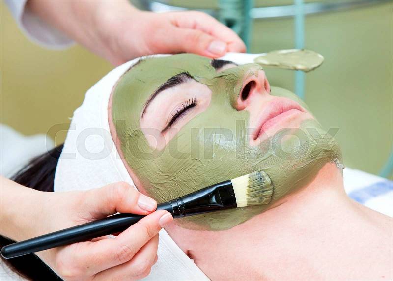 Process of female massage cosmetic mask in a beauty salon, stock photo
