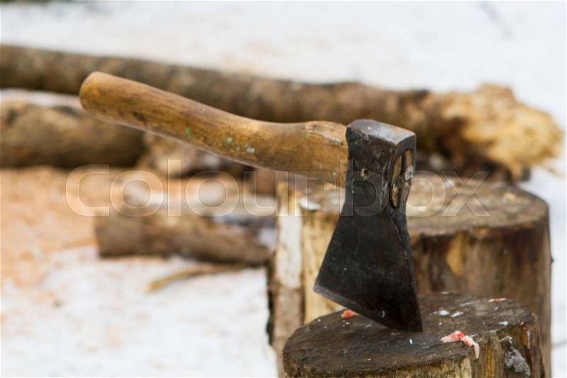 Cut log fire wood and axe . Renewable resource of a energy. Environmental concept, stock photo