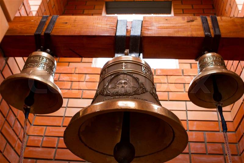 Religious Christian bells. Brick bell tower. The ringing of the bell, stock photo
