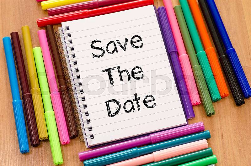 Save the date text concept and colored pens, stock photo
